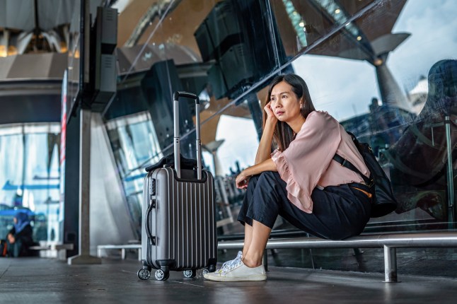 Solo woman traveler waiting for departure