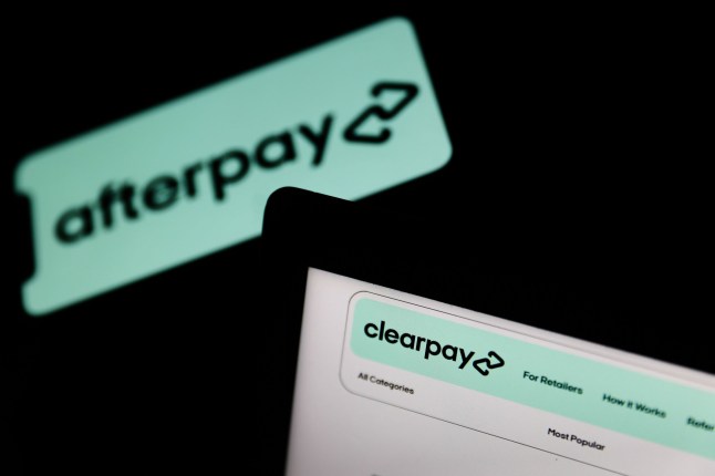 Mandatory Credit: Photo by Jakub Porzycki/NurPhoto/REX/Shutterstock (12310762g) Clearpay website displayed on a laptop screen and Afterpay logo displayed on a phone screen are seen in this illustration photo taken in Krakow, Poland on August 16, 2021. Economy Illustration, Krakow, Poland - 16 Aug 2021