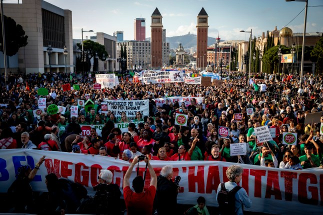 Thousands take to the streets of central Barcelona to demand lower housing costs--both for rent and home ownership--and an end to evictions. The protest, organized by the Tenants' Union and other social groups, is part of a nationwide mobilization across more than 40 Spanish cities. Demonstrators condemn real estate speculation and call for urgent action to guarantee access to affordable housing. According to the Tenants' Union, approximately 100,000 people gather in Barcelona, though the Spanish government's estimate is closer to 15,000. Key demands include a 50% reduction in rental prices, permanent rental contracts, the reuse of vacant and tourist properties, and a ban on eviction companies. Spain's Minister of Housing, Isabel Rodriguez, expresses partial support for the demands, emphasizing the need for inter-institutional cooperation to ensure homes are for living, not speculation. In Barcelona, Catalonia, Spain, on April 5, 2025 (Photo by Albert Llop/NurPhoto via Getty Images)